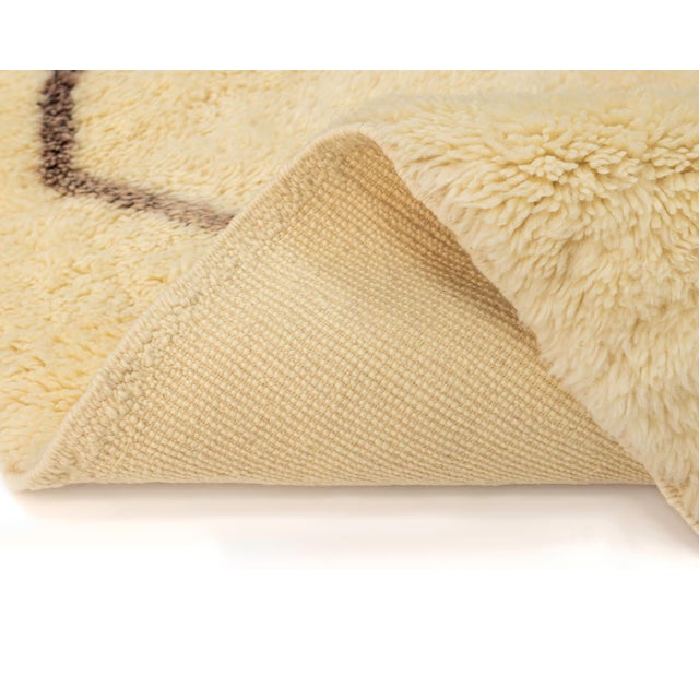 Elegant Hand-knotted rug in Ivory, accented with an Espresso Brown diamond pattern, for a clean and sophisticated look...