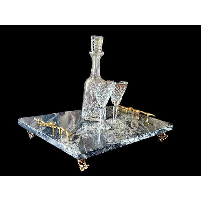 A striking one-of-a-kind marble serving platter featuring beautiful ocean-inspired seafoam movement throughout the natural...