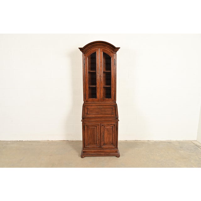 A gorgeous Italian Provincial or Louis XVI style bureau with drop front secretary desk and lighted bookcase hutch top In...