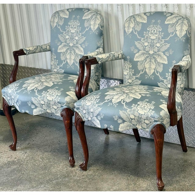 Beautiful pair of upholstered armchairs circa 1980s . Solid wood frame features elegant Queen Anne style legs with shell...
