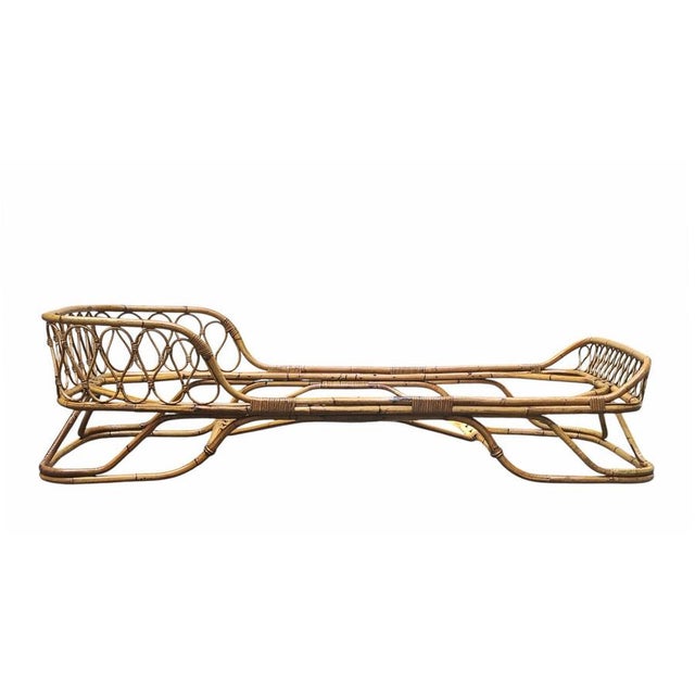 An elegant daybed of fine Italian craftsmanship from the 1960s, attributed to Tito Agnoli for Bonacina. This piece is...