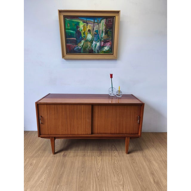 A modernist sideboard from the 1970s. A simple, minimalist chest of drawers. Original condition. Minor scratches,...