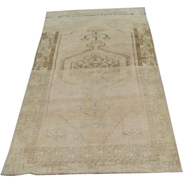 Hand-knotted with care using traditional rug-making techniques, this wool rug blends timeless craftsmanship with a modern...