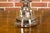 A pair of French crystal single-light table lamps from the mid 20th century on circular lucite bases, wired for the USA....