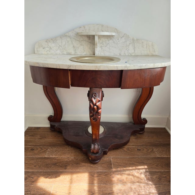Beautiful details in the wood. The marble sits on top of the wood so can be transported in 2 pieces. Stunning piece of...