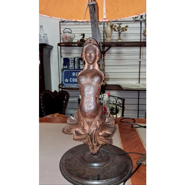 Large Art Nouveau Lamp with a Female Figure in Patinated Cast Iron Early 20th century An elegant Art Nouveau-style lamp...