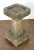A fine English garden bird bath of cut and chiseled Purbeck stone, from the late 19th century, featuring a square top with...