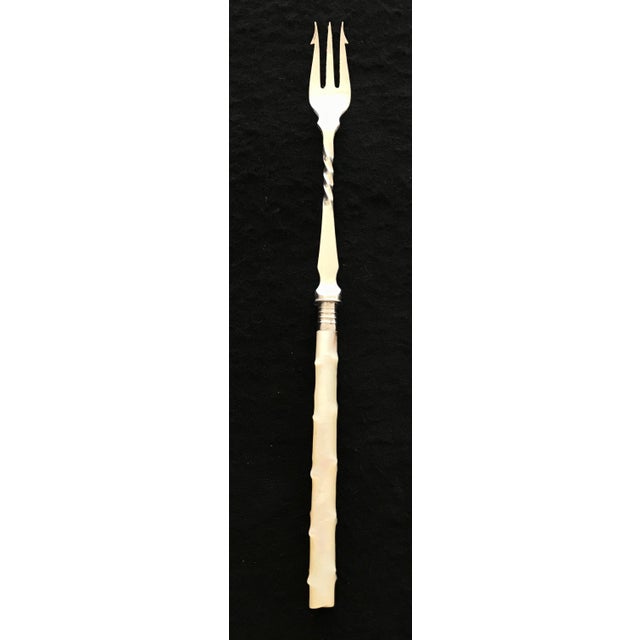 Antique British silver twig mother of pearl pickle fork or hors d'oeuvres fork! This elegant fork has smooth silver...
