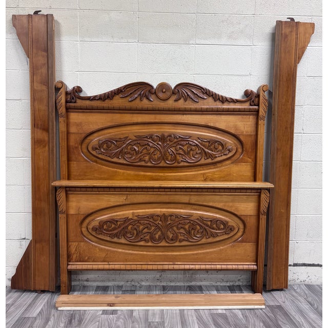 This is a beautiful antique Victorian Eastlake full sized bed, circa 1880s, featuring elaborate carved floral scrollwork,...