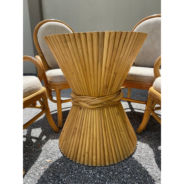 Bamboo dining table set including a round 42' glass top bamboo base table and four (4) chairs with They are in wonderful...