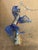 Italian blown cobalt glass with gold speckles horse sculpture mounted on a brass base as lamp finial.