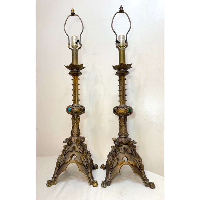 Up for sale is a large pair of original antique electrified 19th century gilt bronze religious candle holder table lamp....