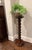A wonderfully sculptural tall wood pedestal distinguished by an exceptionally bold continuous bobbin-turned central...