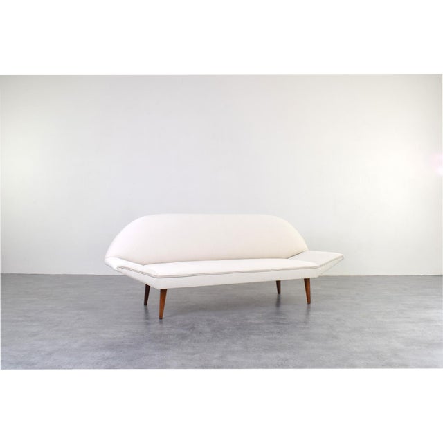 This sofa was manufactured in Denmark in the 1960s. The legs are made of solid teak and are in very good original...