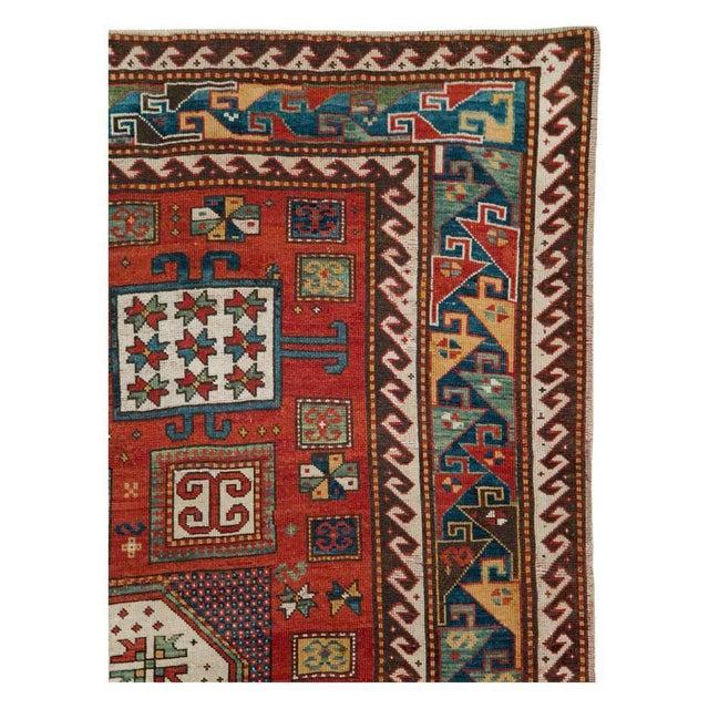 An antique Caucasian Kazak accent rug handmade during the late 19th century. Measures: 6' 3" x 8' 7".