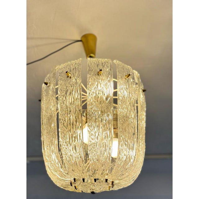 Indulge in the refined elegance of this exceptional kalmar basket chandelier, a true mid-century luxury piece crafted in...