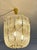 Indulge in the refined elegance of this exceptional kalmar basket chandelier, a true mid-century luxury piece crafted in...