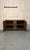 An 18th-century chestnut sideboard, crafted in Gothic style and featuring two finely decorated doors on the front. The...