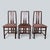 Three matching labelled Primo London chairs with tall twin-splat backs, dark stained timber frames and muted rose-brown...