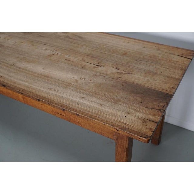 This elegant table was made in Southern France in the early 20th century. The table was made in solid elm with beautiful...