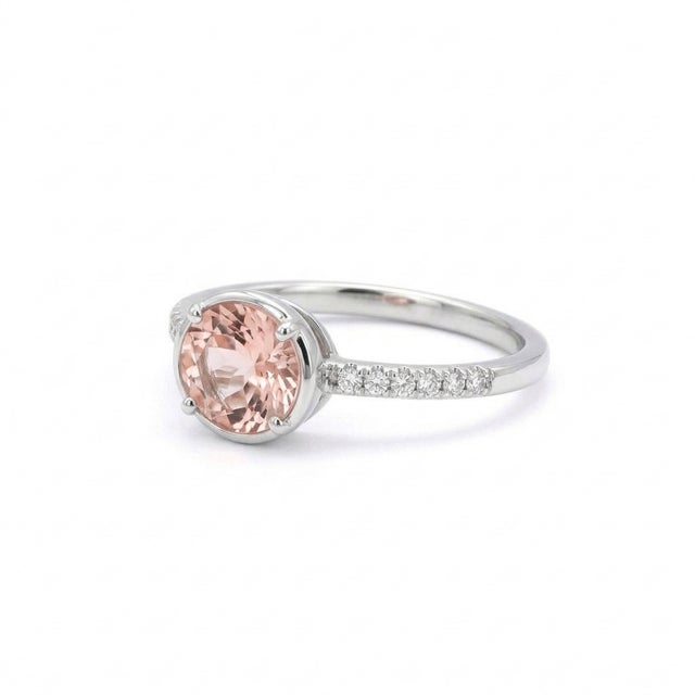 This elegant ring features a radiant Morganite gemstone, admired for its soft blush-pink hue and delicate brilliance....