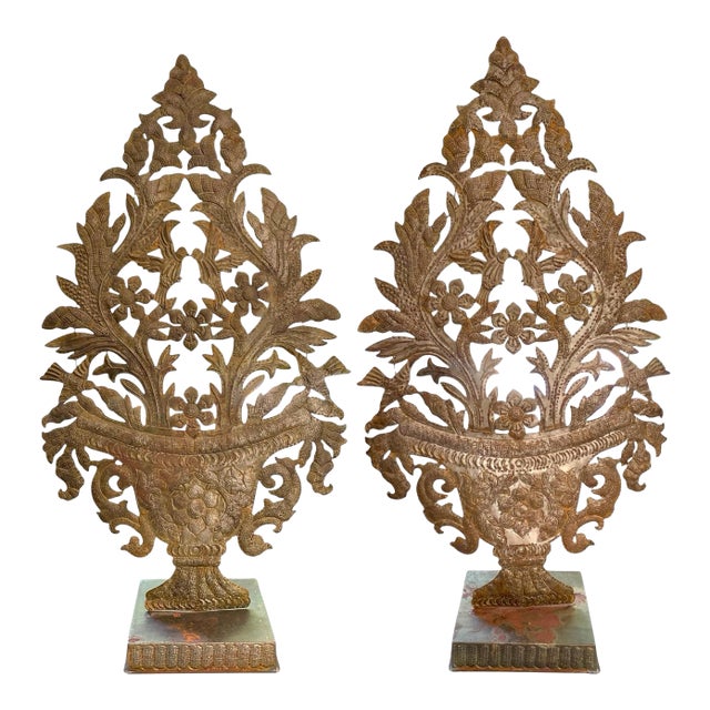 A Pair of Metal Repoussé Urn Form Garnitures on Stands For Sale