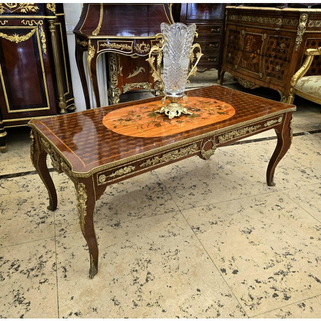 Bring timeless European elegance to your living space with this beautiful French Louis XV-style coffee table, crafted with...