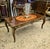 Bring timeless European elegance to your living space with this beautiful French Louis XV-style coffee table, crafted with...