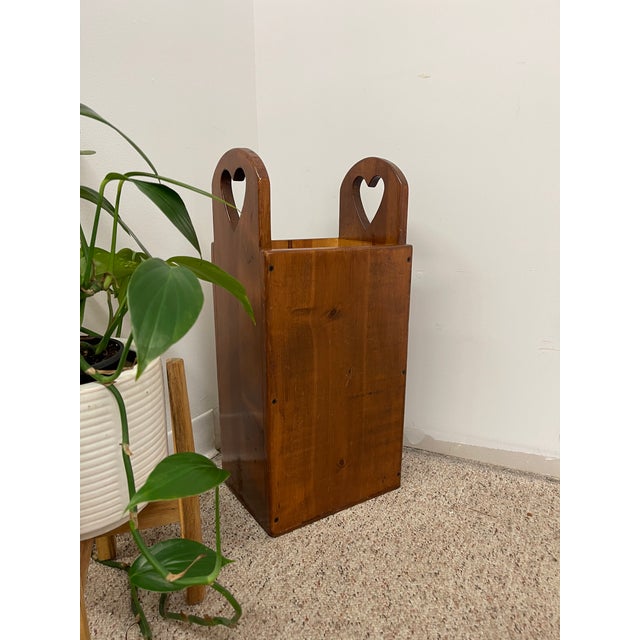 Charming vintage wooden umbrella stand featuring heart-shaped cutout handles and a warm honey-brown finish. Crafted from...