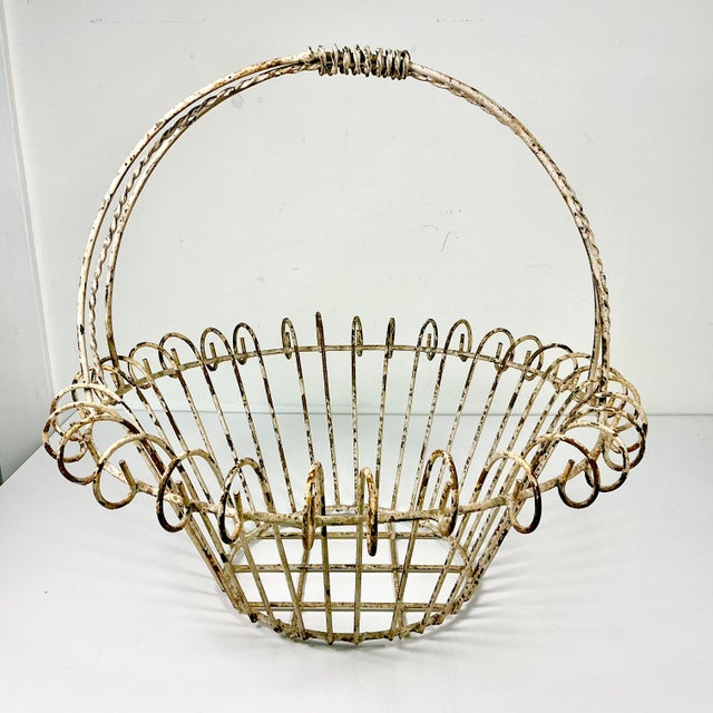 Vintage Home is pleased to present this vintage French Art Nouveau Iron Basket Jardiniere Planter. We curated this...