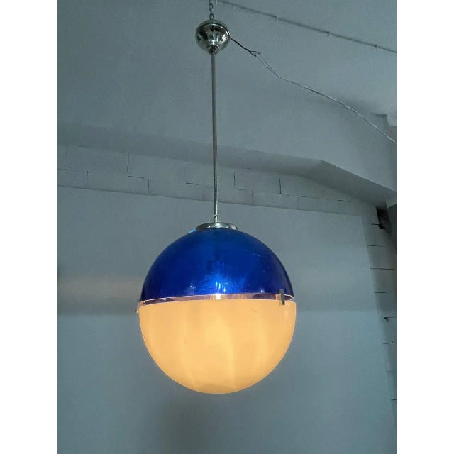Two-tone blue and white acrylic glass and nickel-plated brass chandelier. Fits a large-base lamp. dimensions: h 60 cm w 35...