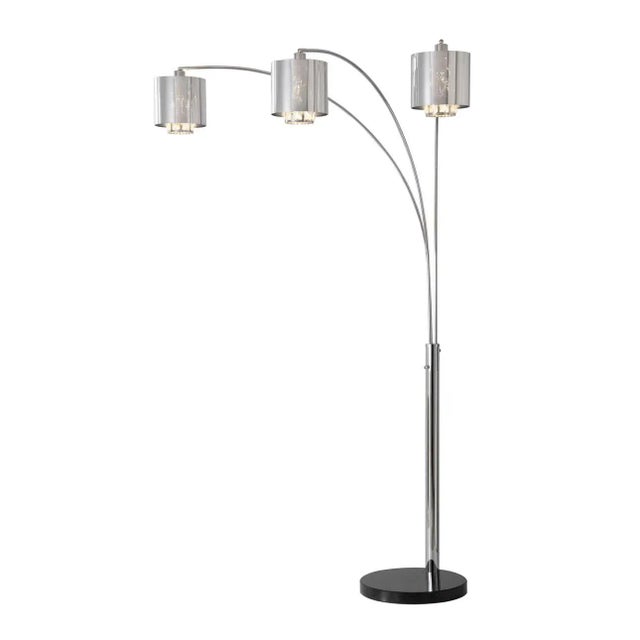 The Marilyn 3 Light Arc Floor Lamp elevates your space with its luxurious appeal, featuring cut crystals concealed behind...