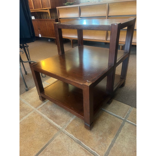 Beautiful Nichols and stone side table two tiered wood table. Measures: 26' deep bottom tier and 14" deep top tier 25"...