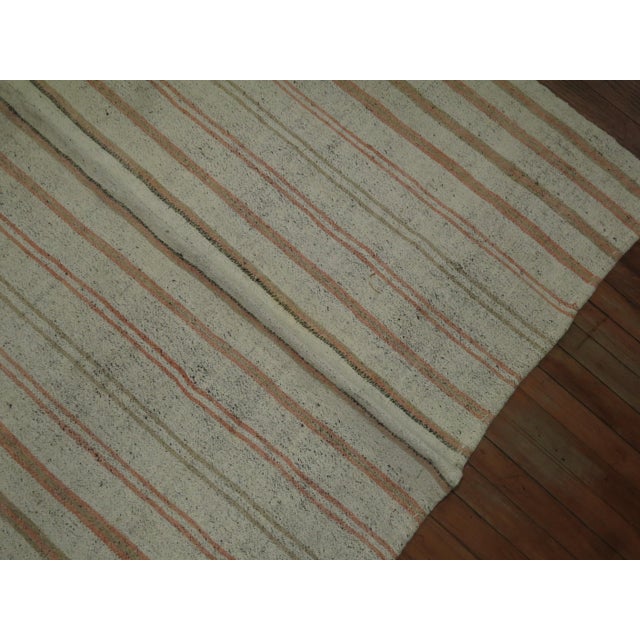 Gallery size midcentury Turkish Kilim in brown, peach accents on a white ground. Suitable for a beach home.