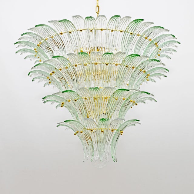 Large mid-century modern palmette chandelier in murano glass, barovier and toso style, 1970s italy. The chandelier is...