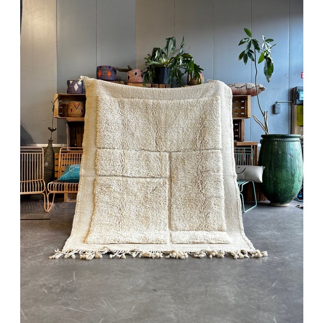 This refined Beni Ouarain rug was handwoven in the Atlas Mountains of Morocco using traditional Berber weaving techniques....