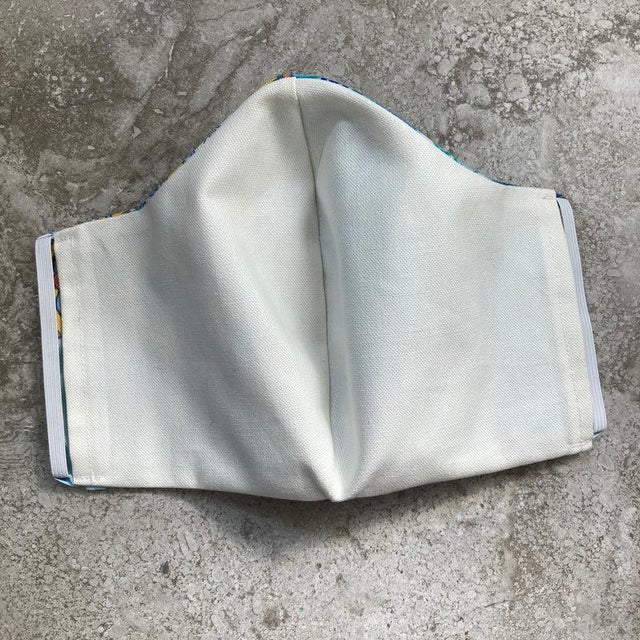 Authentic Hermes L'Art du Sarasa Silk Scarf reinvented into a face mask. Original silk screen scarf design c.2020 by Aline...