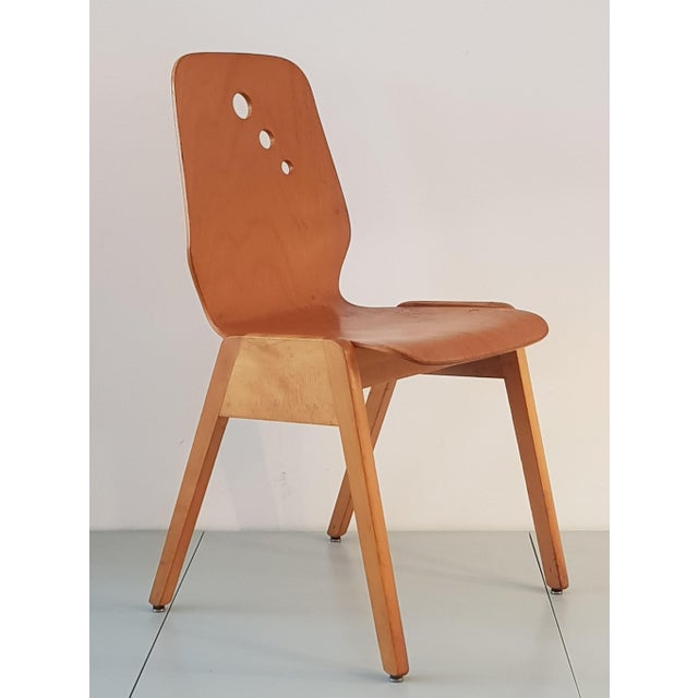 Ideal chair for the dining or catering area, robust, elegant, playful thanks to the rising holes in the backrest, very...