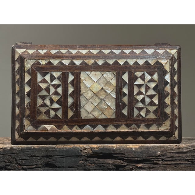 Antique Folk Art Mother of Pearl Inlaid Hand Carved Footed Table Box A hand carved wooden table box featuring fine mother...