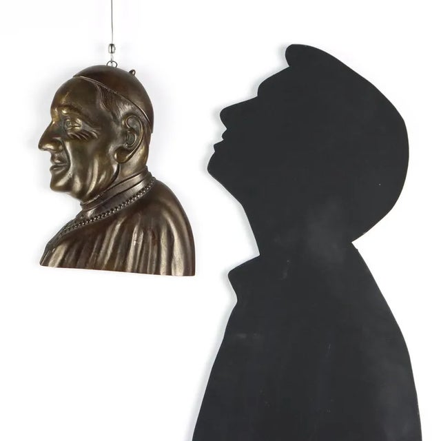 Face of Pope John XXIII in bronze. This piece is attributed to the mentioned designer/maker. It has no attribution mark...
