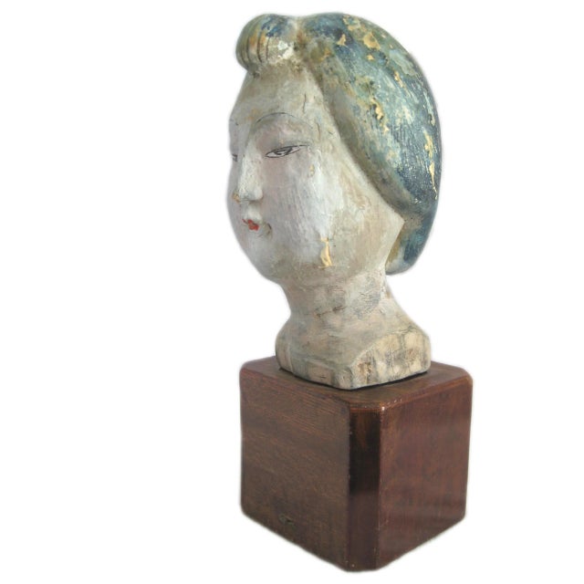 Rare, hand-carved Asian head displayed on a wooden stand. 10.5" H x 5" W H6