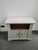 Small lacquered two-door sideboard with an open central compartment. Excellent overall condition, with minor signs of...