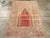 This early 20th century Turkish Sivas rug, measuring 3' 5" x 4' 9", features a classic prayer rug format distinguished by...