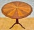 Elegant Spanish side table crafted during the mid-20th century, featuring a beautifully executed circular marquetry top...