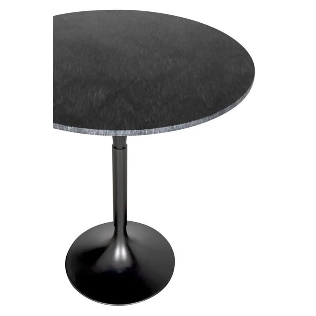 The JMAN Bar Table in Matte Black is a striking blend of modern sophistication and industrial edge. Featuring a luxurious...
