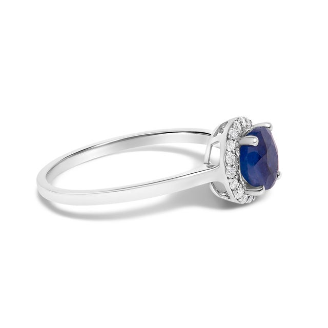 Adorn your hand with the splendor of rich, velvety blue captured in a mesmerizing 6x6 mm sapphire, its fiery hues deepened...