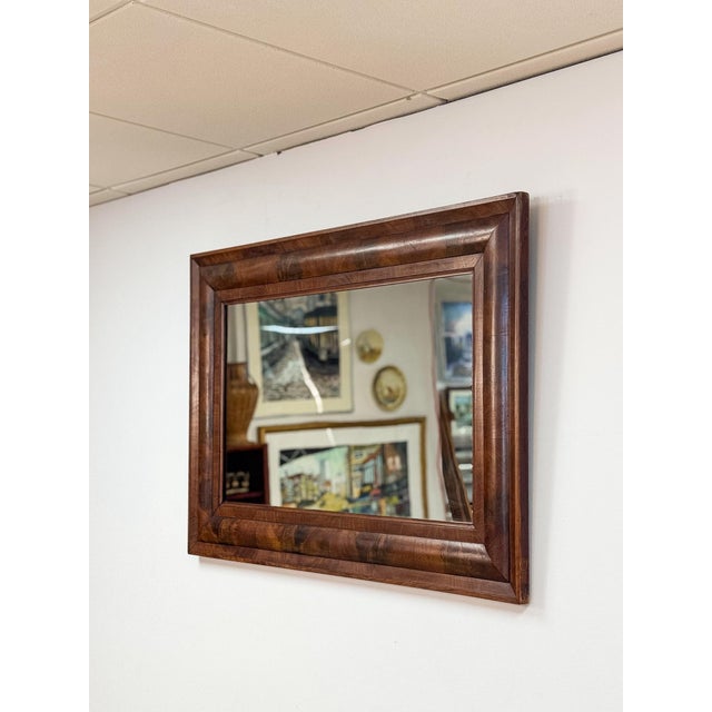 This vintage mirror showcases the distinctive "tiger oak" grain pattern, prized for its bold, striped figuring that gives...