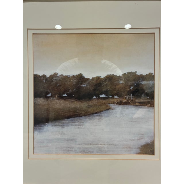 An elegant framed landscape print by Trowbridge, depicting a tranquil lakeside setting with gently rolling grounds, mature...