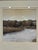 An elegant framed landscape print by Trowbridge, depicting a tranquil lakeside setting with gently rolling grounds, mature...