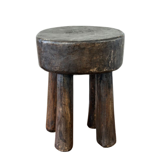 This stunning vintage African wooden milk stool, skillfully crafted by the Hehe Gogo people in Tanzania from one piece of...